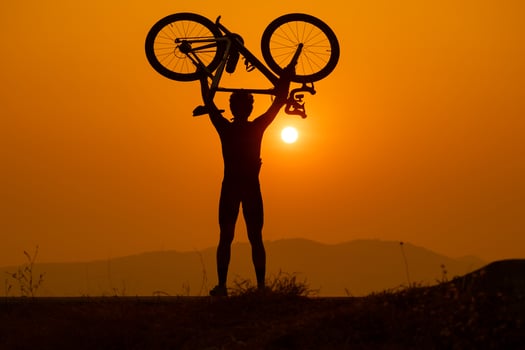 Silhouette of a cyclist on sunset in Thailand. photo
