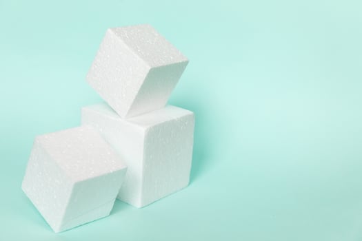 White rectangular cube shapes on blue background. Minimal boxes geometric forms podium. Empty unbranded shopfront. Showcase for cosmetic product. Mockup style design. Cosmetology and beauty concept. photo