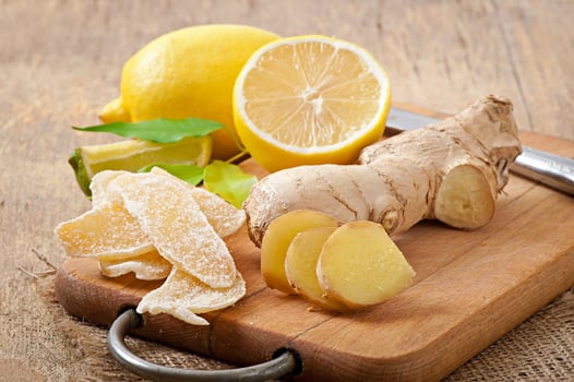 Fresh ginger root, candied ginger and lemon photo