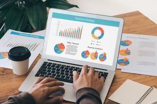 accounting concept. businessman working using a laptop with analyzing finance sales data and economic growth graph chart. at the coffee shop. photo