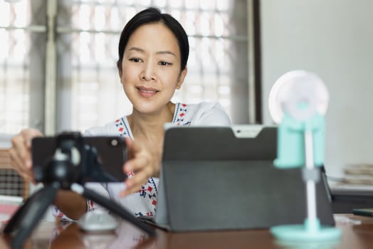 Woman working online preparing  broadcasting live in home office. photo