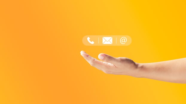Male hand holding icons phone, email, address. Customer service center contact, marketing email and newsletter. Ideas for a contact page or email marketing. photo
