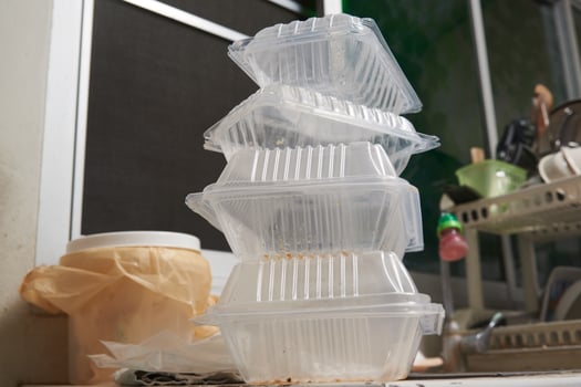 Plastic boxes after meal in the kitchen photo