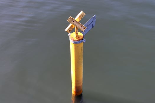 Different bollards and technical installations of vessel traffic at a port photo