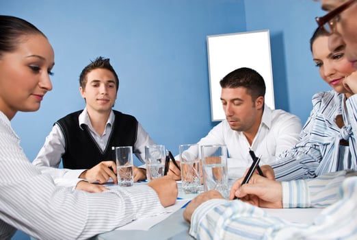 Office workers in the middle of business meeting photo