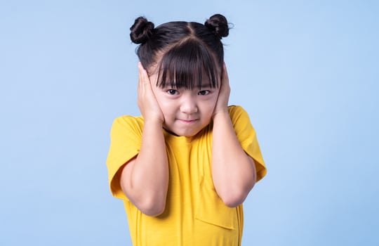 Image of Asian child posing on blue background photo