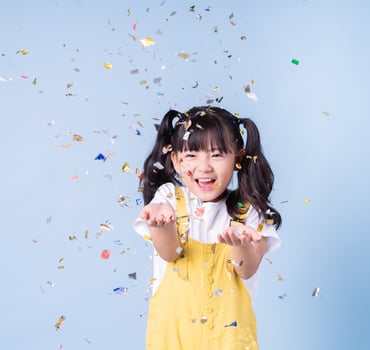 Portrait of Asian child posing on blue background photo