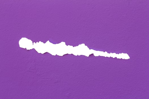 Concrete wall torn purple. photo