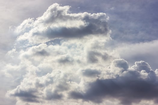 Fluffy clouds backlit scenery. photo