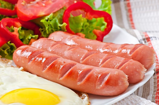 Fried sausage, egg and mixed salad photo