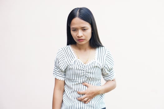 Woman suffer from stomachacheChronic gastritis Abdomen bloating concept photo