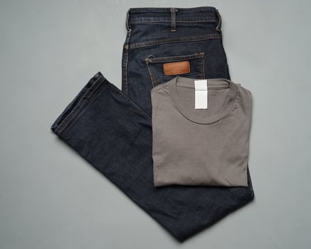 Modern jeans and cotton t-shirt. Contemporary pants are often used as a fashion choice for today's people. Jeans are durable and not easily damaged. Jeans mockup for design templates. long pants shirt photo