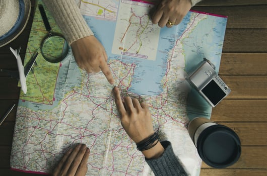 Top view travelers planning in holidays for vacation trip with map , Travel concept background photo