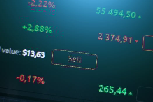 sell button on the background of exchange charts of currencies, crypto exchange photo