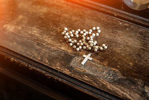 catholic cross in the church on the old table photo