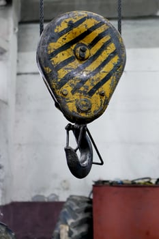winch with a hook on the ceiling of the workshop photo