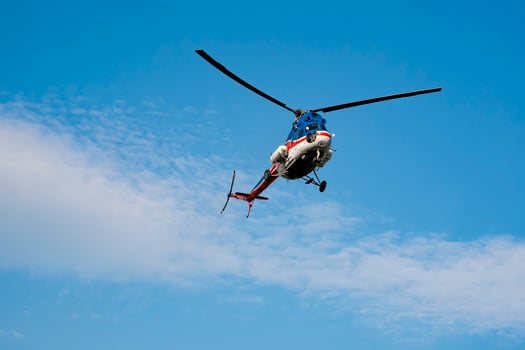 rescue helicopter against the blue sky photo