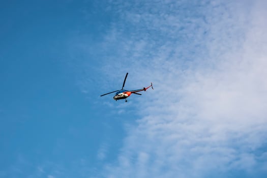rescue helicopter against the blue sky photo