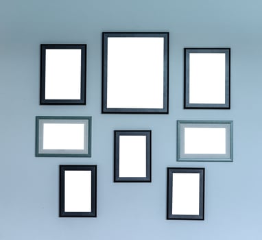 Multiple photo frames on cement wall