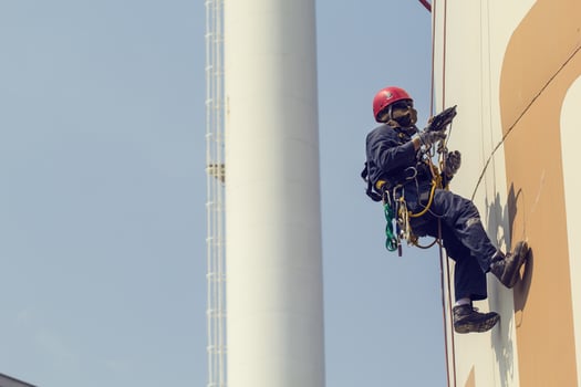Male worker rope access  inspection photo