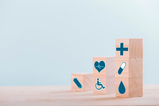 Emoticon icons healthcare medical symbol on wooden block , Healthcare and medical Insurance concept photo