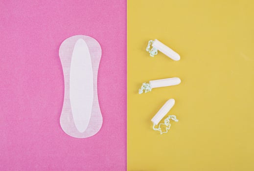 Hygiene care during critical days. Choosing between a tampon and a sanitary pad. Menstrual cycle. Hygiene products for women. Top view photo