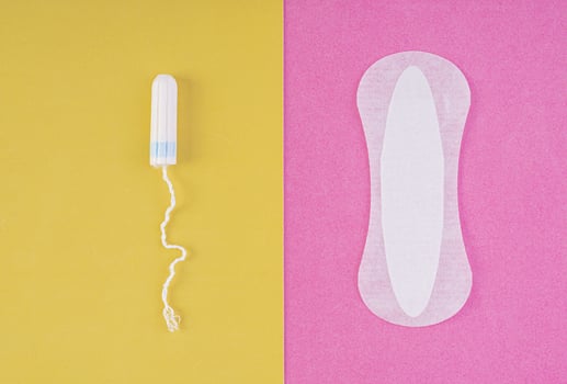 Hygiene care during critical days. Choosing between a tampon and a sanitary pad. Menstrual cycle. Hygiene products for women. Top view photo