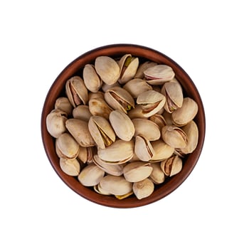 Isolated pistachio nuts. Roasted salted pistachios. Top view photo
