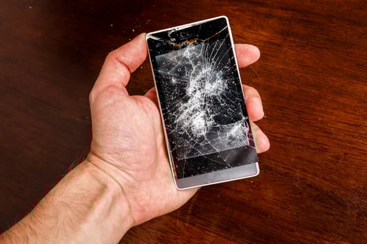 Smartphone with cracked display photo