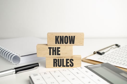 Know the rules word on wooden blocks isolated on dark grey background photo