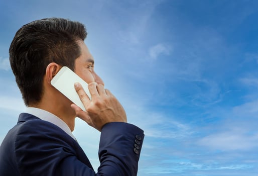 Young attractive business man using smartphone photo