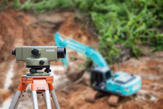 Surveyor equipment theodolite at construction site photo
