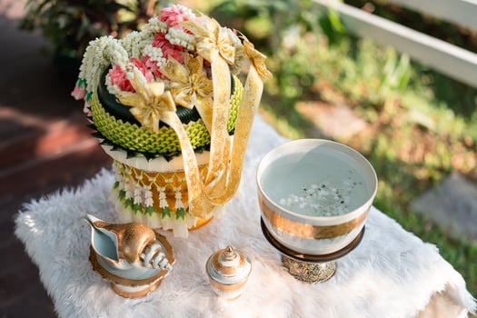 Conch watering ceremony with shell, holy water, garland on pedestal on wedding day photo