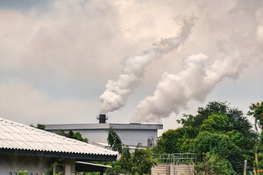 Emission smoke pollution to the air from industrial plant chimney photo