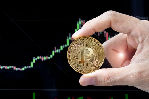 golden Bitcoin cryptocurrency coin with candle graph background, Crypto is Digital Money within the blockchain network, is exchanged using technology and online internet exchange. Financial concept photo