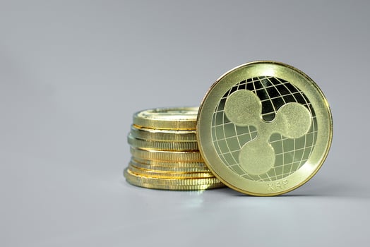 golden Ripple cryptocurrency coin stack, Crypto is Digital Money within the blockchain network, is exchanged using technology and online internet exchange. Financial concept photo