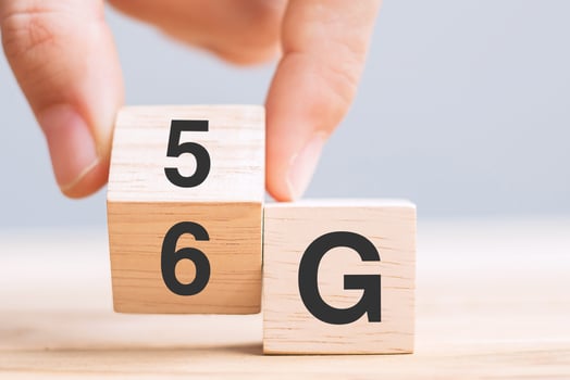 Businessman hand change wooden block from 5G to 6G Generation of Cellular Mobile Communications Technology, network, Social media and digital concepts photo