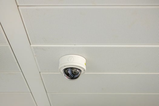 Modern Security Camera with office or house background, cctv to record and property protection for car park photo