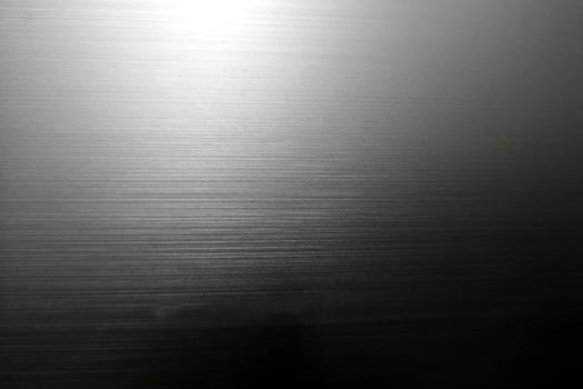 Gray black glossy paper texture abstract background, wallpaper or backdrop Arts. empty wrapping paper, poster, shiny paperboard for decorative design element, stainless steel smooth surface desig photo