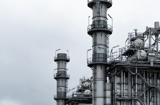 Gas turbine electrical power plant. Energy for support factory. Natural gas tank. Chimney tower of gas power plant. Power plant using natural gas for fuel. Green energy. Power station against gray sky photo