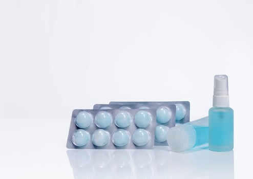 Alcohol spray in glass bottle container, Hand sanitizer in plastic tube, and cotton ball with alcohol in blister pack for cleaning hand to protect coronavirus. Medical supply for personal hygiene. photo