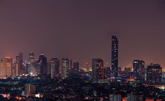 Cityscape of modern building in the night. Modern architecture office building. Skyscraper with beautiful evening sky. Business and financial center building. Apartment in the city with night light. photo