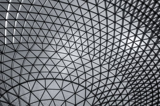 Glass and steel building with triangle pattern structure. Futuristic architecture. Neo-futurism architectural style. White triangle geometric dome texture. Creative art design of modern building. photo