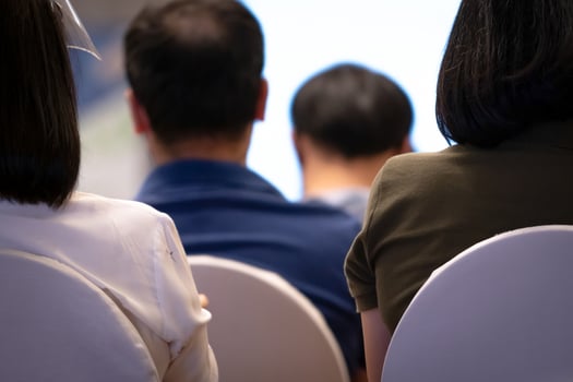 Business seminar and conference event. The audience at corporate meeting and presentation in convention hall. Professional speaker talking to people at seminar and meeting room. Business training. photo