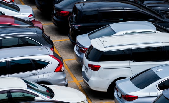 Car parked at parking lot of the airport for rental. Aerial view of car parking lot of the airport. Used luxury car for sale and rental service. Automobile parking space. Car dealership concept. photo