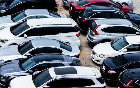 Car parked at parking lot of the airport for rental. Aerial view of car parking lot of the airport. Used luxury car for sale and rental service. Automobile parking space. Car dealership concept. photo