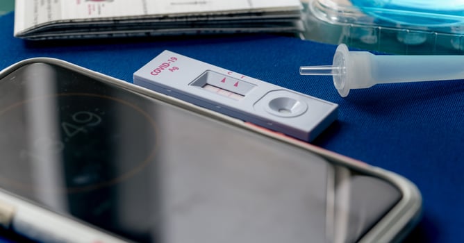 Covid 19 antigen self-test for nasal swab with positive result. Antigen test kit for home use to detection coronavirus infection. Positive test result from rapid antigen test. Coronavirus diagnosis. photo
