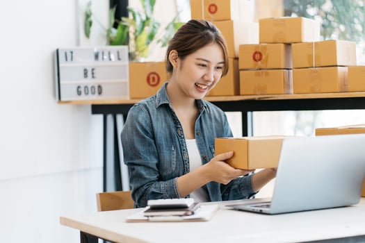 Small Business SME entrepreneur of Young Asian women working with laptop for Online shopping at home,Cheerful and Happy with box for packaging in home,Own Business Start up for Business Online photo