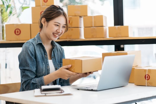 Small Business SME entrepreneur of Young Asian women working with laptop for Online shopping at home,Cheerful and Happy with box for packaging in home,Own Business Start up for Business Online photo