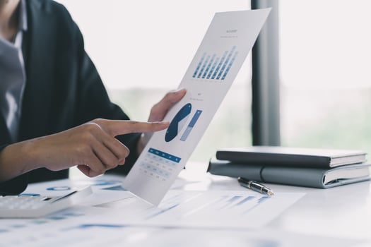 Two businessman investment consultant analyzing company financial report balance working with documents graphs. Concept for marketing plan, strategy brainstorming and team meeting. photo